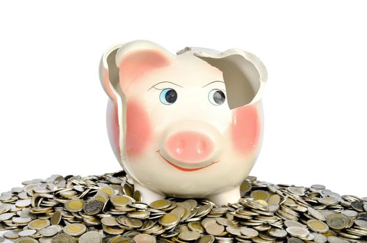 Pink piggy bank broken with money isolated on white background