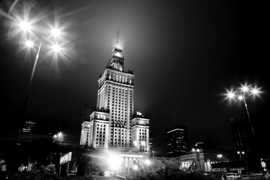 Warsaw, Poland downtown skyline at night in black and white. The Palace of Culture and Science - Palac Kultury i Nauki