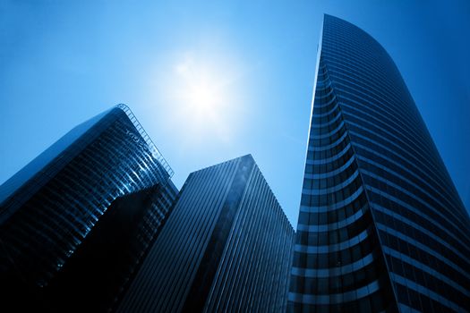Business skyscrapers, sunny blue sky. La Defense financial district in Paris, France.