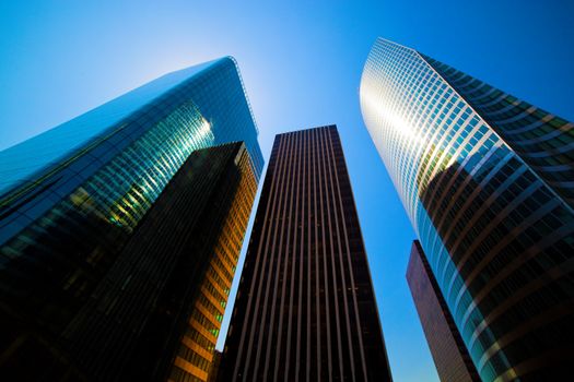 Business skyscrapers, sunny blue sky. La Defense financial district in Paris, France.