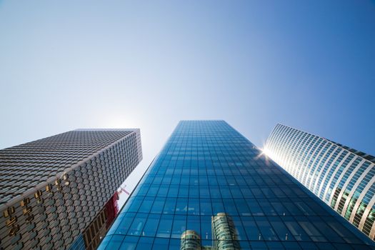 Business skyscrapers, sunny blue sky. La Defense financial district in Paris, France.