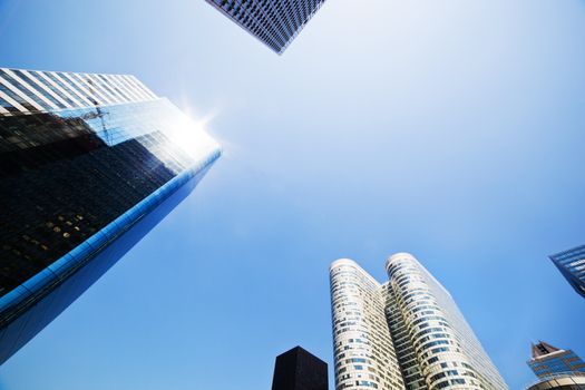 Business skyscrapers, sunny blue sky. La Defense financial district in Paris, France.