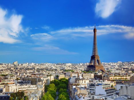 Rooftop view on the Eiffel Tower from Arc de Triomphe. Sunny day, blue sky. Tour Eiffel