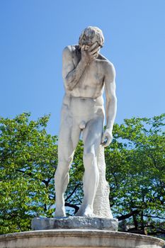 Statue in Tuileries Garden, near Louvre, Paris, France. Jokingly speaking looks like facepalm