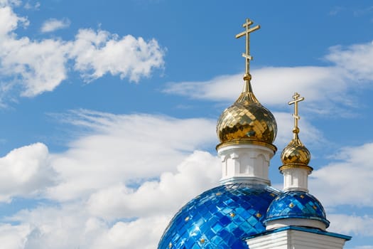 Domes of the church on sky background