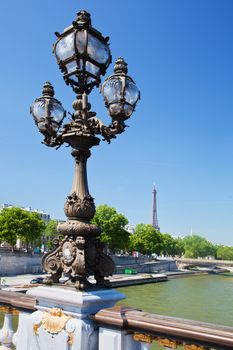 Eiffel Tower and bridge on Seine river in Paris, Fance. View from Alexandre Bridge at sunny day