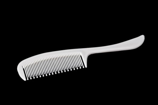 Hairbrush on black background