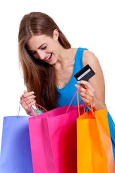 happy young woman with colorful shopping bags visa credit card isolated