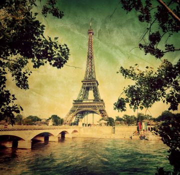 Eiffel Tower and bridge on Seine river in Paris, France. Vintage retro style