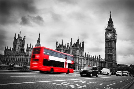 London, the UK. Red bus in motion and Big Ben, the Palace of Westminster. The icons of England