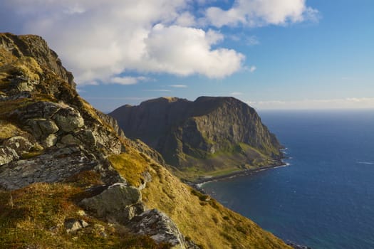 Scenic coastal cliffs on island of Vaeroy, Lofoten islands in Norway