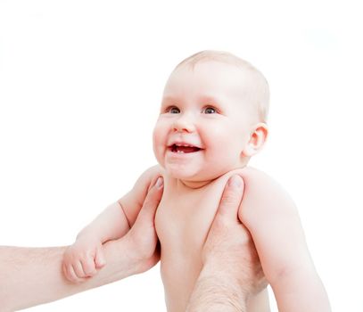 Cute happy baby laughing, held by his father. Portrait on white background