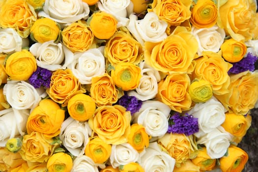 Wedding flowers in yellow and white with a touch of purple