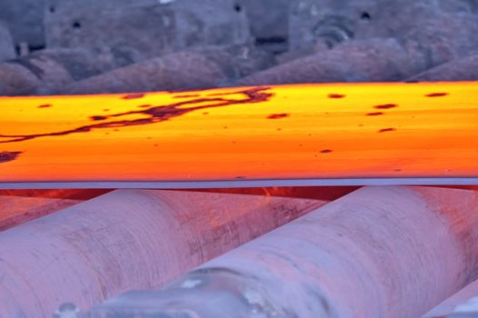 hot steel on conveyor, macro