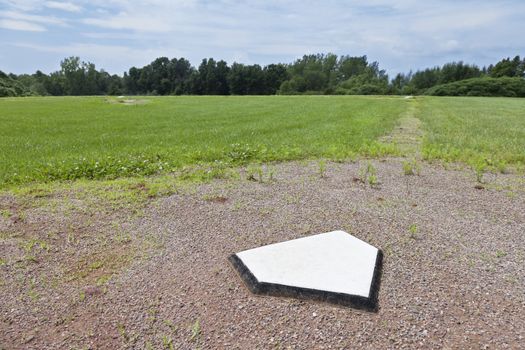 Home plate of a baseball diamond in a rural community.