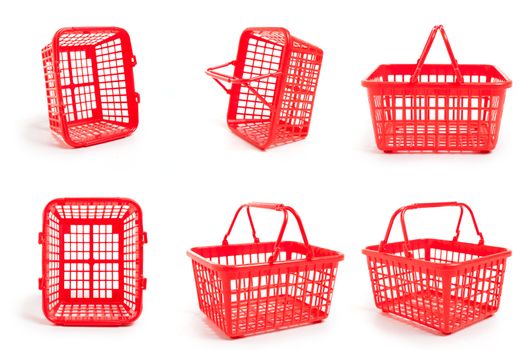 Six empty red shopping baskets against a white background.