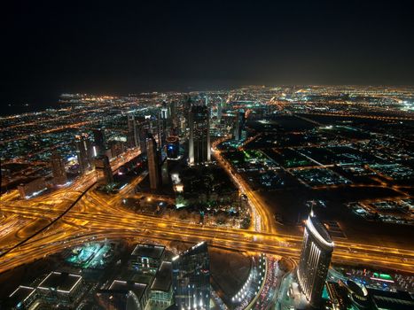 Skyscrapers in Dubai at night. View from the lookout Burj Khalifa. United Arab Emirates