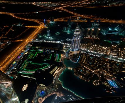 Skyscrapers in Dubai at night. View from the lookout Burj Khalifa. United Arab Emirates