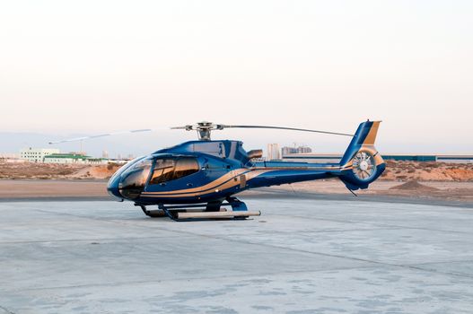 Modern helicopter at helipad, United Arab Emirates