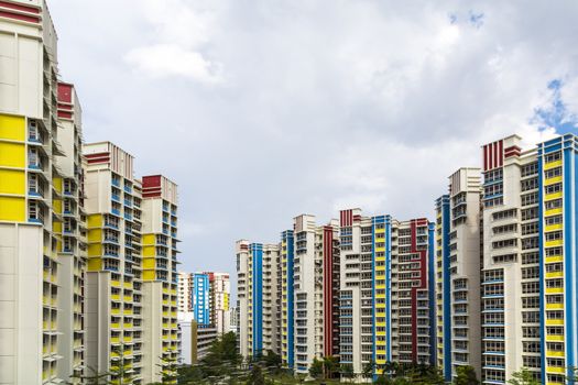A color residential estate with a park and carpark.