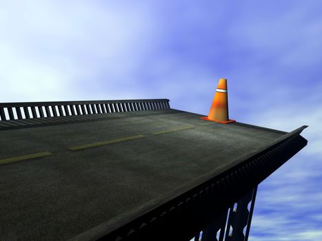 Orange cone standing at the end of road and cloudy blue sky