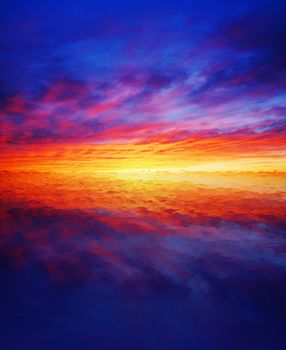 Beautiful colorful sunset reflected over water