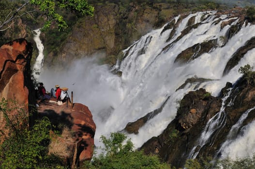 Artist at the Ruacana waterfalls on the boder between Angola and Namibia 