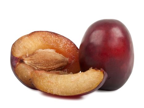 some delicious fresh plums over white background