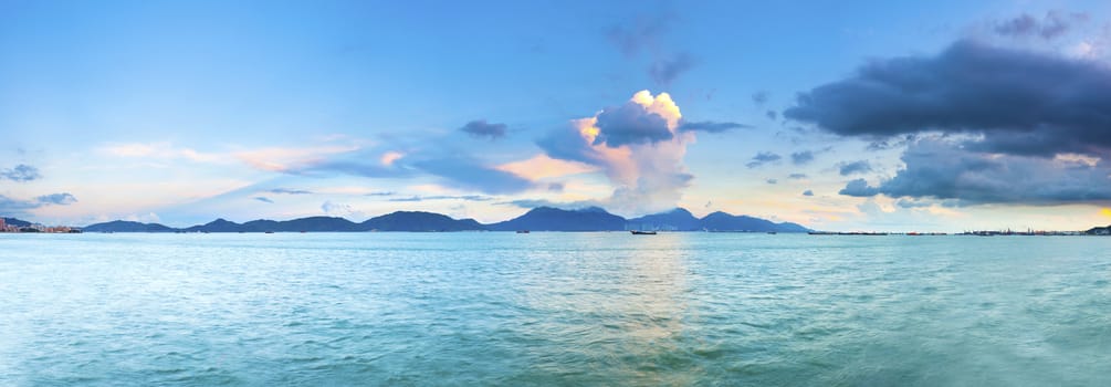 Sunset along sea stones coast in Hong Kong