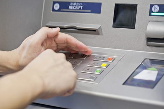 Hand using atm machine