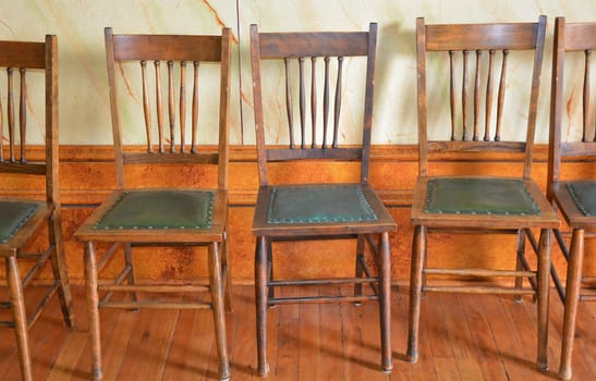 Old wooden chairs on hardwood floor