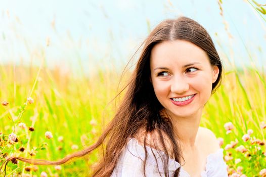 beautiful young girl in a field of flowers