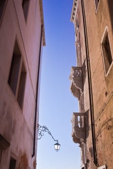 Two facades on a narrow street  Venice