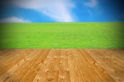 old wooden floor terrace with view to beautiful green lawn