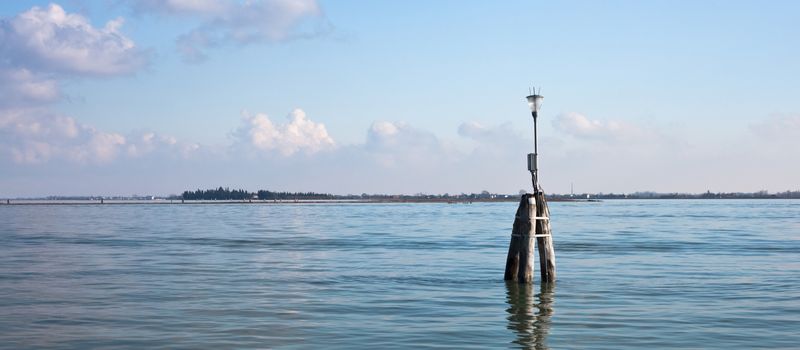 Venetian buoy along fairway channel between the islands