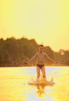 boy jumping in river
