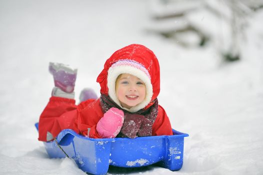 girl on sleigh