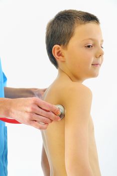 boy having health check with stethoscope in hospital 