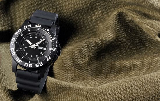 military watch on sack background