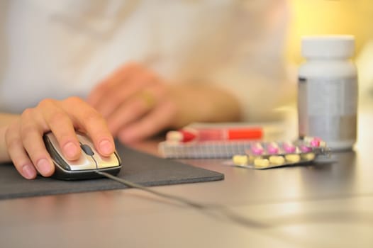 hand of doctor operating mouse on an isolated background