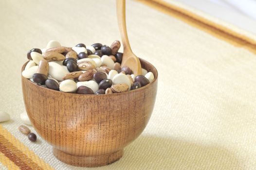 colored beans in wooden bowl