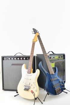 guitars and amplifiers on white background