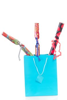 Blue shopping bag with three gifts for christmas
