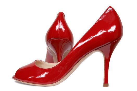 Red female shoes on a white background