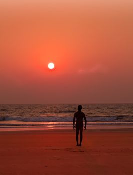 Yoga exercises at ocean sunset  Man s silhouette Tadasana