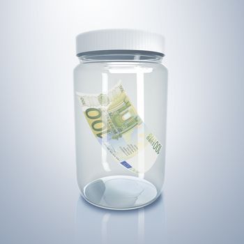 Transparent glass jar with money inside it