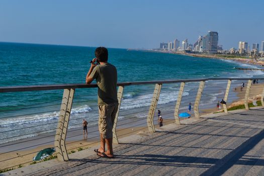 Man using mobile phone on the beach