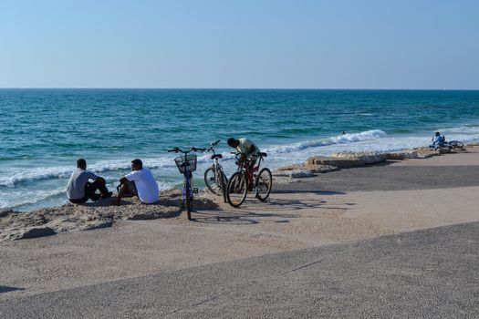 Young men on the Tel Aviv beach