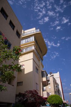 Buildings  against cloudy blue sky