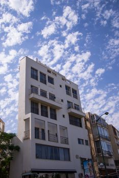 New and old buildings against blue sky